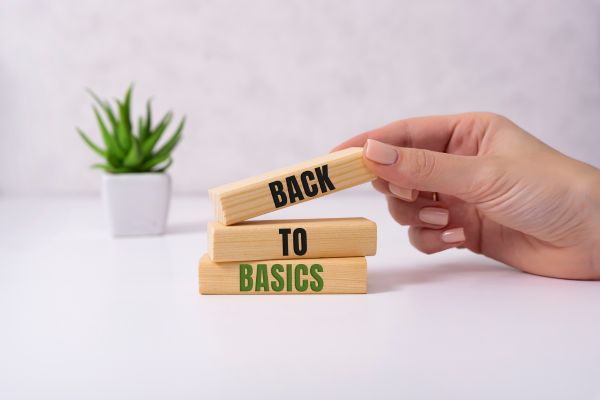 an image of a jenga blocks with words on a white background with plant.